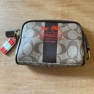New and authentic Coach Heritage Stripe small cosmetic bag.